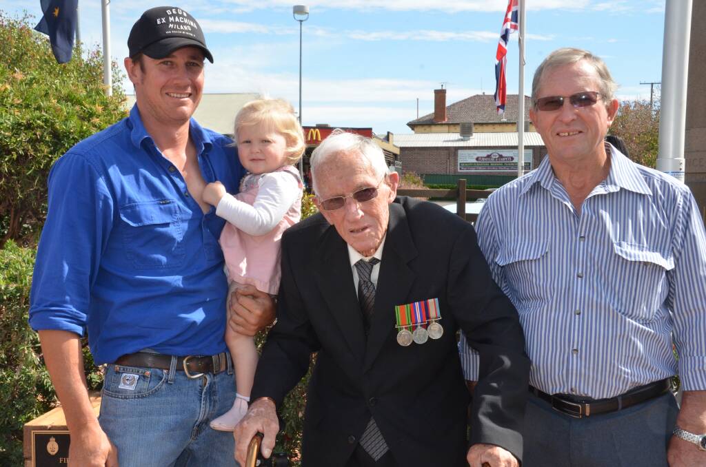 FOUR GENERATIONS: World War II gunner Victor Gardner watched the service with three generations of his family, from left, grandson Ian and great grand daughter Maggie, and son Steve, right.
