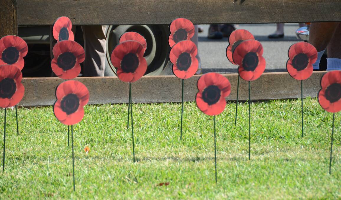 REMEMBRANCE: A field of poppies were positioned behind the cenotaph for the service to commemorate the fallen.