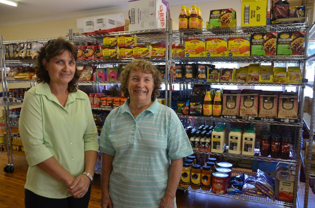 FOOD PANTRY: Carolyn Marquett and Maree Roach are volunteers at the Seventh Day Adventist Church food pantry in Gunnedah.