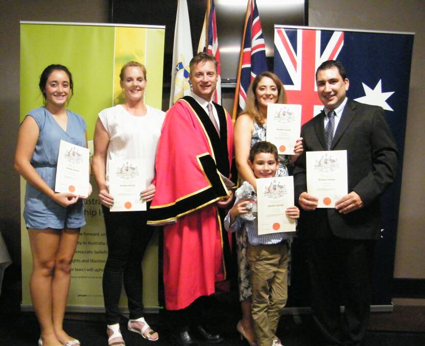 AUSTRALIAN: Gunnedah mayor Jamie Chaffey, centre, welcomes five Gunnedah residents as new Australian citizens.