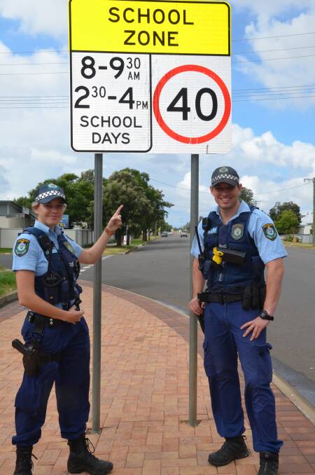 SCHOOL ZONES: Gunnedah Police senior constables Amber Selvage and Chris Hart remind motorists school zones are back in force.