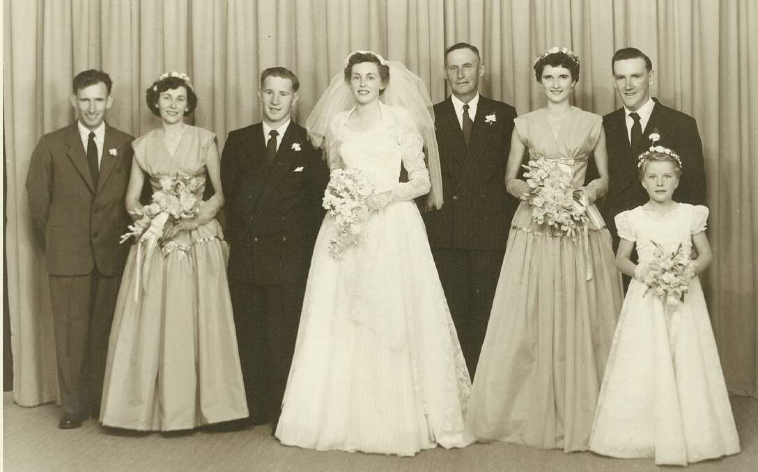 The wedding party, from left, Tommy McGee, Doreen Whitton, Robert Anderson, Shirley Anderson, Allan Whitton, Elaine Novely and Reg Wilkinson. Flowergirl: Elizabeth Emond.