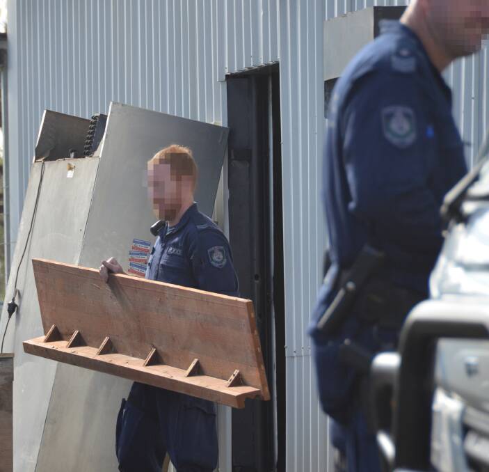 CLUBHOUSE DISMANTLED: Oxley police and Strike Force Raptor officers stripped the Gladiators OMCG base bare last week and issued three fines totalling $15,000 for breaches of the development consent. Photo: Kate Ramien