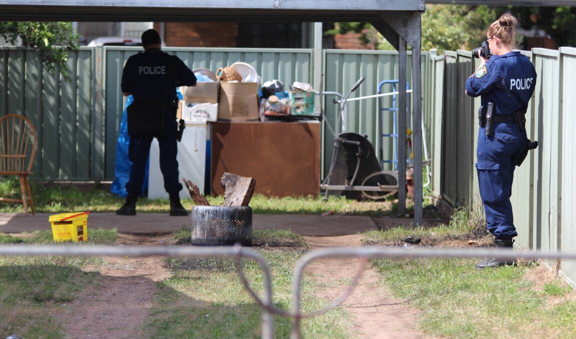 Crime scene: Specialist forensic police examine the backyard where the explosion occurred in Little Barber St in Gunnedah, last year. Photo: Sam Woods