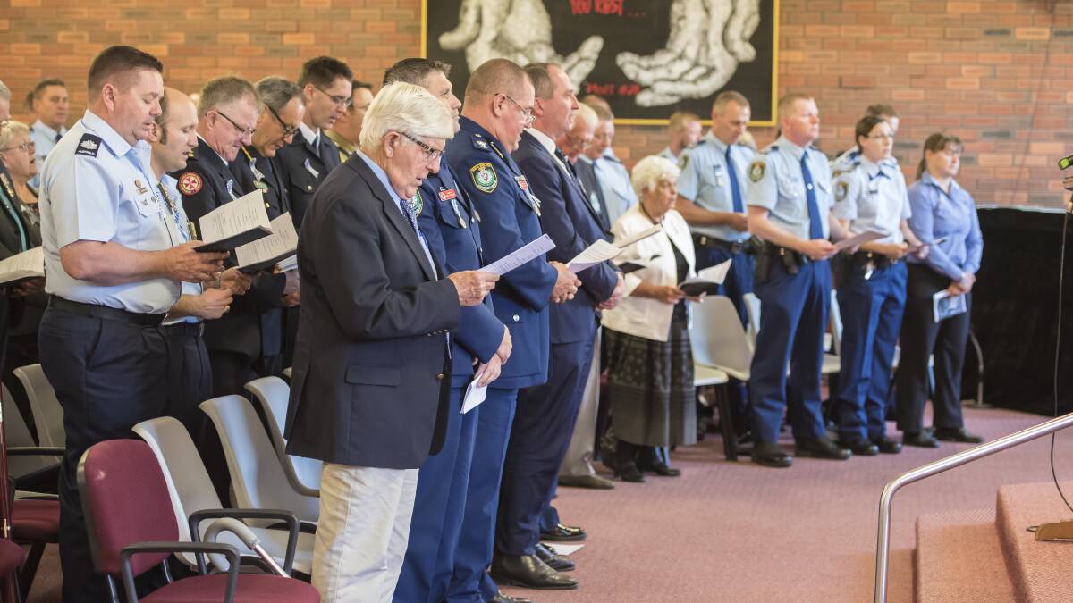 Honouring the fallen: Oxley police as well as members of the defence forces, RFS, Ambulance NSW, Fire and Rescue NSW, Police Legacy, retired officers and community members attended the service. Photo: Peter Hardin