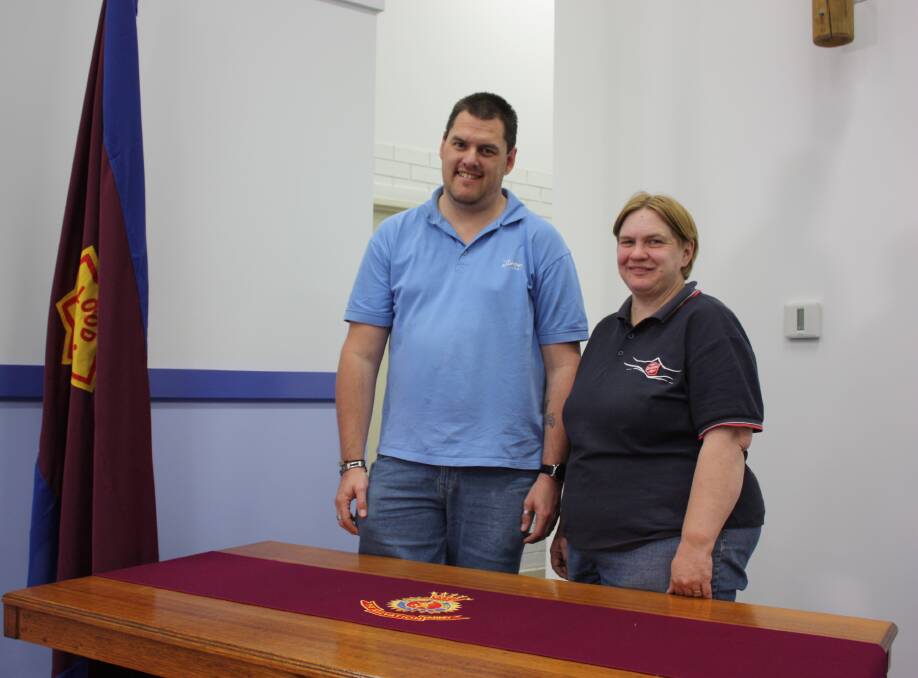 NEW BEGINNINGS: Gunnedah Salvation Army Captains Richard and Gaye Day stand beside the Holiness Table which has found a new home in the Tempest Street building.