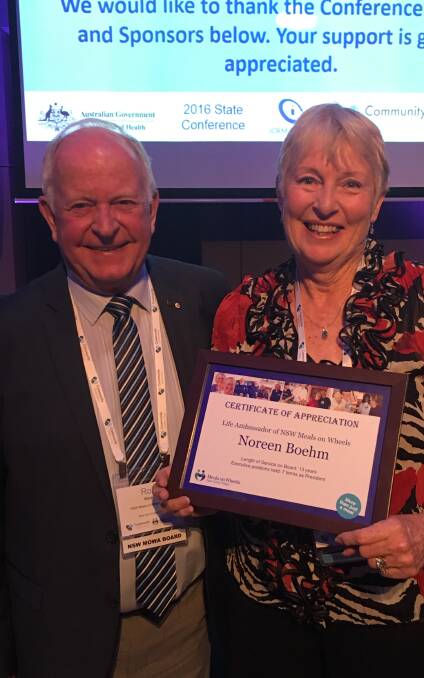 Highest accolade: NSW Meals on Wheels Association board president, Ron Welsh who presented Noreen Boehm with a Life Ambassador award for her dedication.