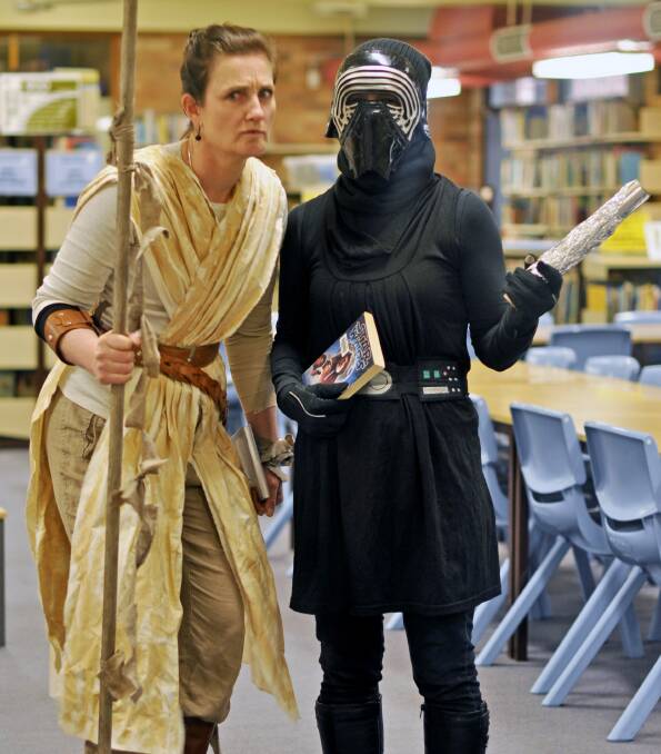 Gunnedah High School librarian Simone Carlyon and assistant Dee Bruce as Rey and Darth Vader from Star Wars: The Force Awakens.