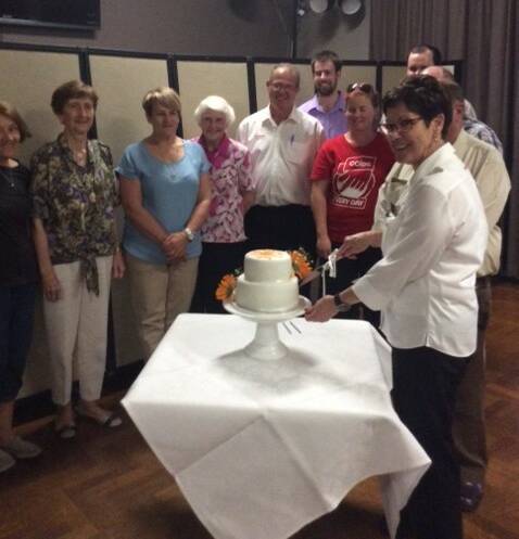 Jeanie Baxter cuts the cake at her celebratory lunch on Tuesday.