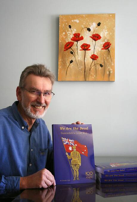 Geordie Clark with copies of his book We are the Dead - Gunnedah's Great War. Photo: Cate Clark