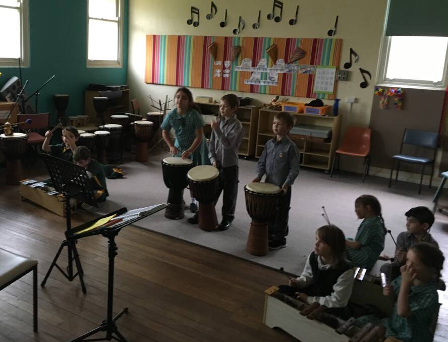 Gunnedah Public School's 2C enjoy making music with Julia Rennick.