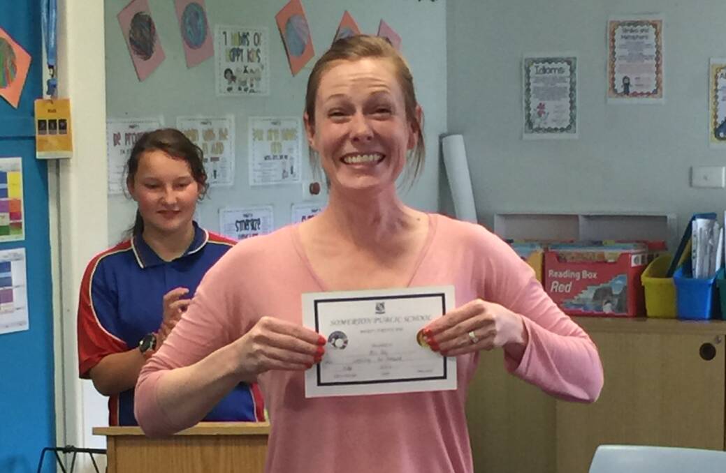 Drue Daly is thrilled to receive a merit award at Somerton Public School.