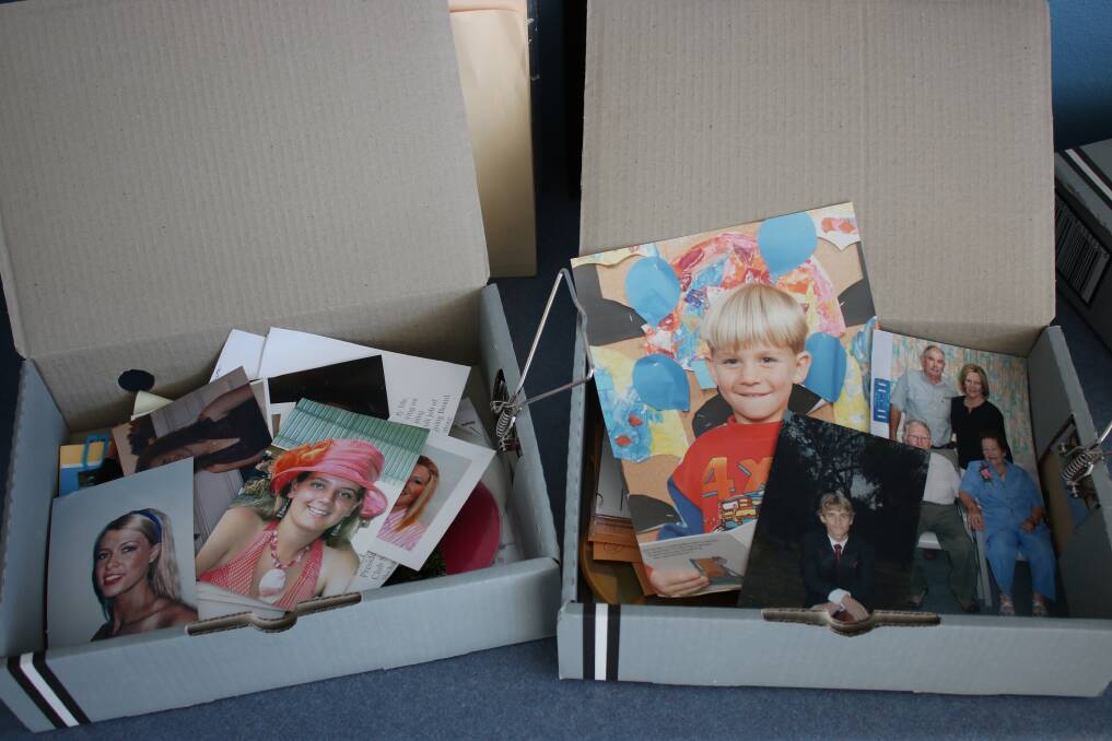 FORGOTTEN: Hundreds of photos are looking for their rightful homes.
