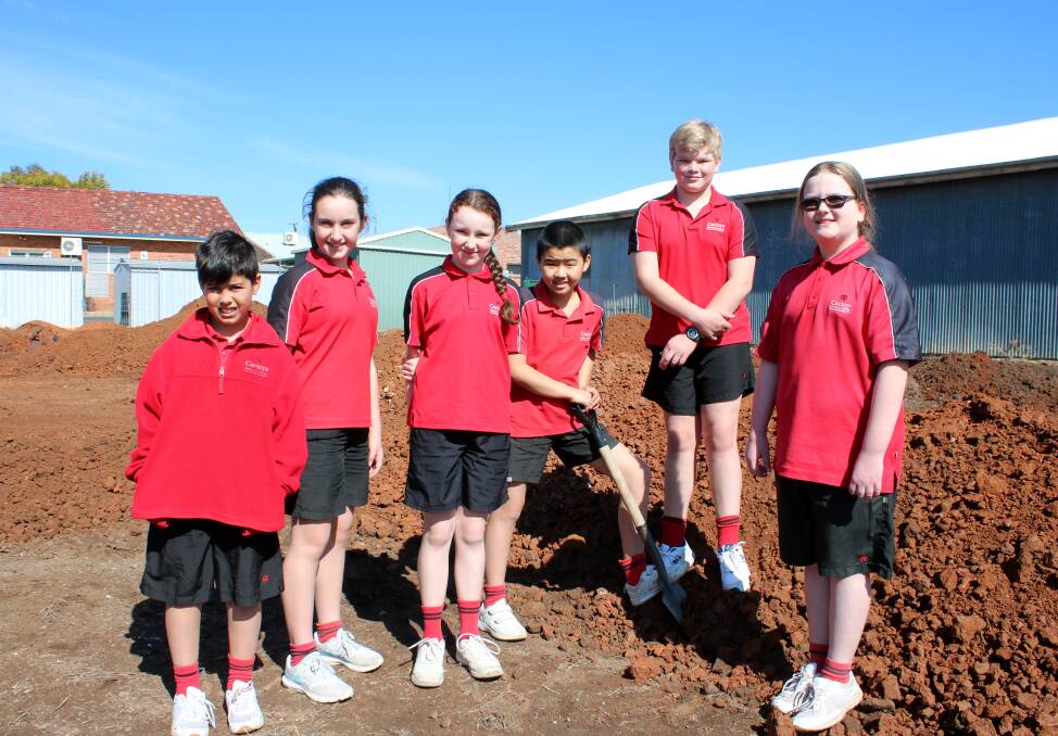 Years 4-6 Carinya students at the site of the new middle school on Tuesday. From left, Noah-Dane Stamp, Alice Roach, Kiara May McKay, Wesley Law, Alexander McArthur and Annabelle Biggar.