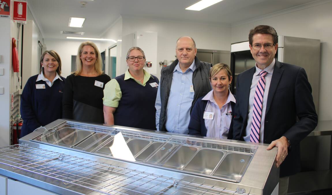 GRAND TOUR: Symone Law, Kylie Whitford, Ashlea Payne, Brian Logan, Jenean Murray and Kevin Anderson in the new kitche at Gunnedah District Hospital.