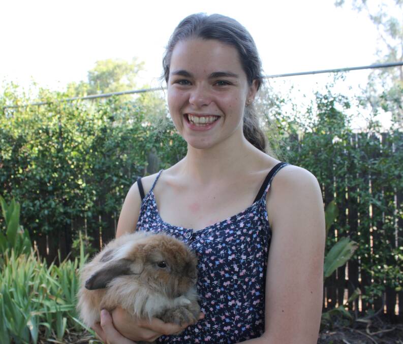 Gunnedah's Amelia Dunlop with her sister's pet rabbit Gru.