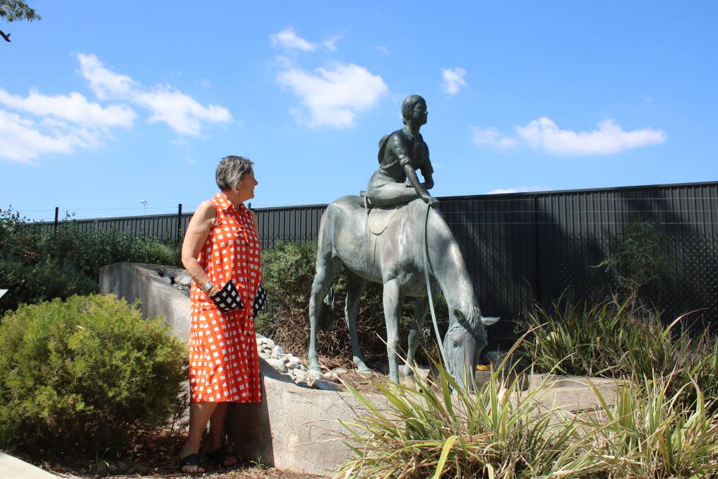 Dorothea Mackellar Memorial Society member Philippa Murray with the Dorothea Mackellar monument. The pool complex can be seen in the background.