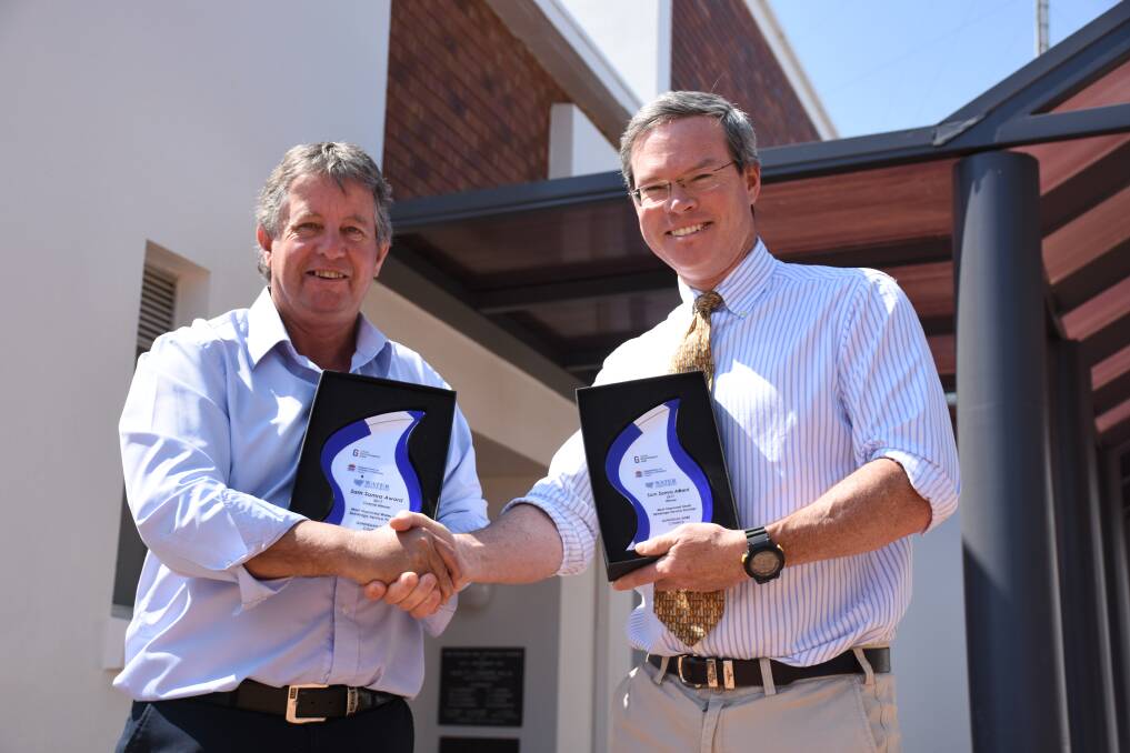 Gunnedah Shire Council's water services manager, Kevin Sheridan, and acting director of infrastructure services, Edward Paas, with the water management awards.