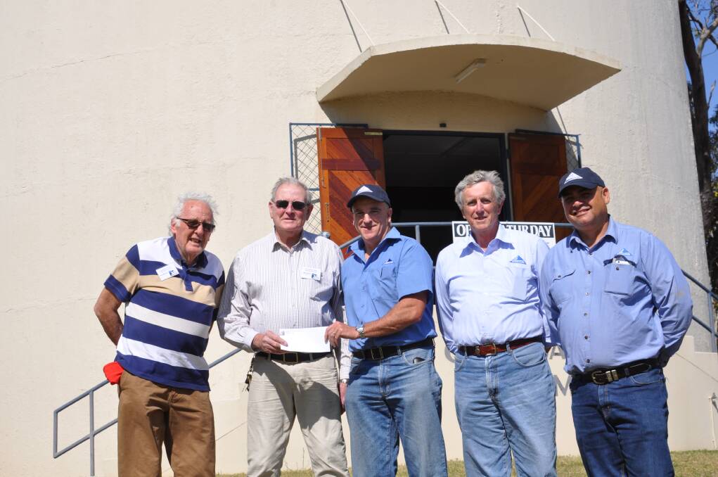 Whitehaven Coal representatives presenting a cheque for $5000 to Gunnedah and District Historical Society. Pictured author Ron McLean, society president Bob Leister and Whitehaven's Tim Muldoon, Daryl Campbell and Bob Sutherland.