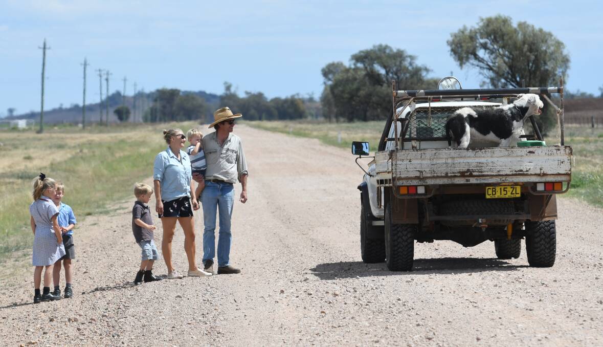 The Bell family stop to chat to a local on the Grain Valley Road on Monday. Photo: Gareth Gardner