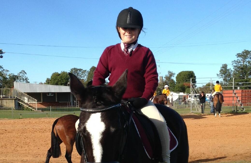 Kaiya Henry is all smiles as she competes against riders from Wee Waa, Tamworth, Gurley, Manilla and Gunnedah.