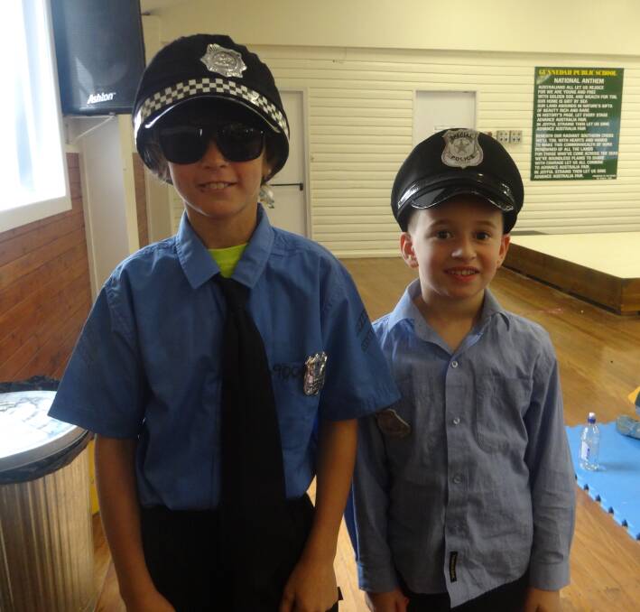 Gunnedah Public School students Dekoda Bell and Luke Perrett dress as police officers for Book Week.