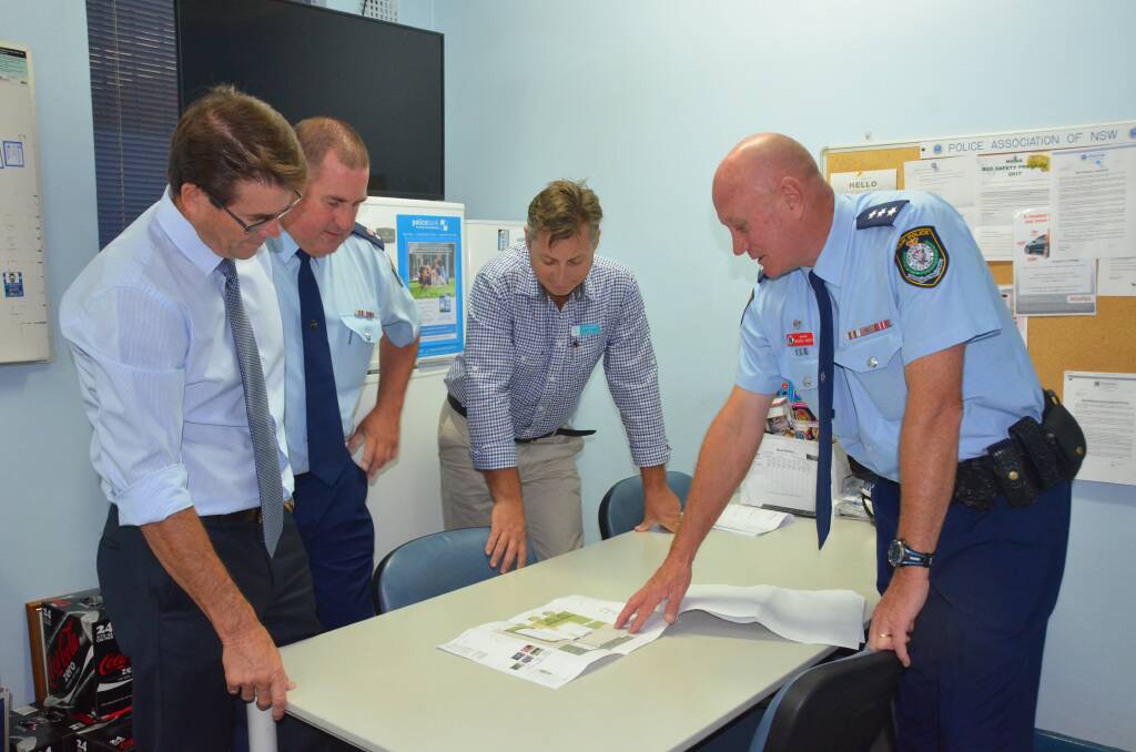 Member for Tamworth Kevin Anderson, Oxley Acting Commander Jeff Budd, Gunnedah mayor Jamie Chaffey, and Gunnedah Police Inspector Michael Wurth examining plans for the new station in February.