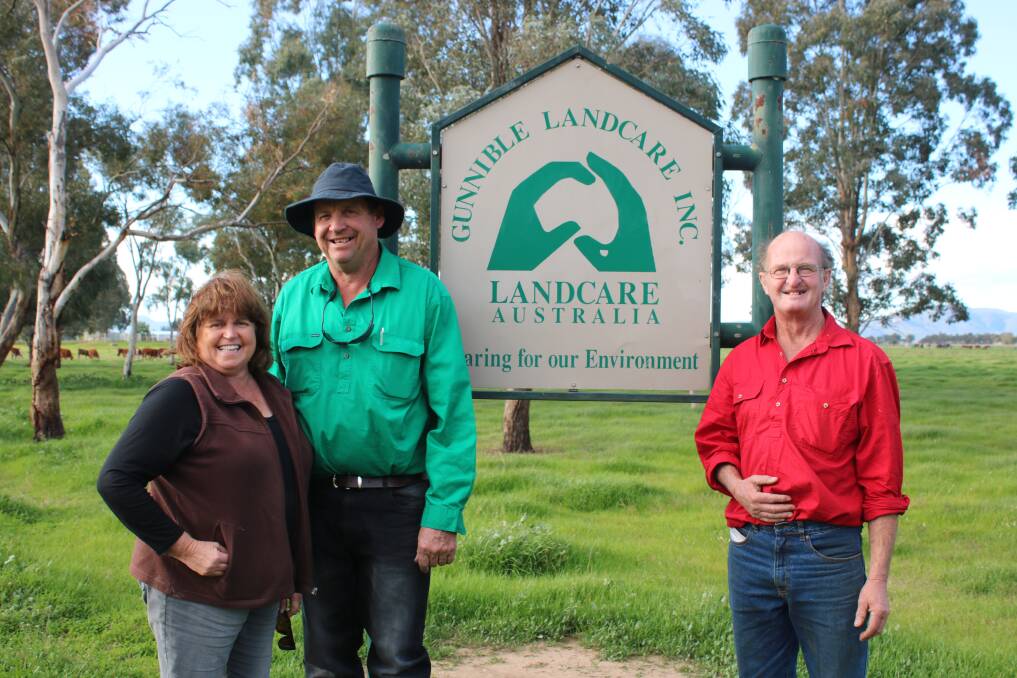 LASTING LEGACY: Gunnible Landcare's Donna and Greg McIlveen, and Geoff Hood are pleased with progress. Behind them are some of the many trees the group has planted.