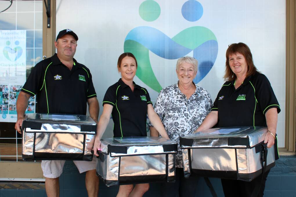The Parkview Hotel provides fresh meals for Gunnedah Meals on Wheels. Pictured are Parkview publicans Greg and Belinda Thomas, and employee Jen Shorter with meals ready to be delivered by Meals on Wheels president Colleen Fuller (second from right). Photo: Vanessa Höhnke