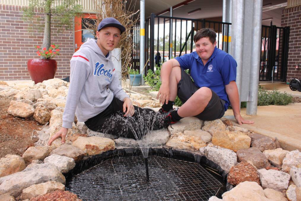 LEARNING SPACE: GS Kidd Memorial School students Tyson Small and Ethan Leader have been observing the changes taking place in the garden area.