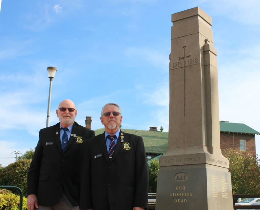 NEW LEADERSHIP: Gunnedah RSL sub-branch's retired president Peter Clarke and new president Peter Kannengiesser at Gunnedah's cenotaph ahead of Anzac Day.