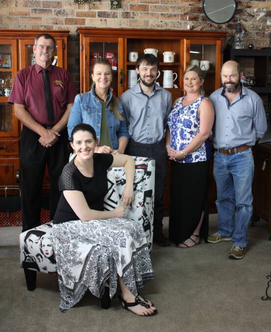 Staff Laurence Kelly, Jodi and Josh Dolbel, Jodie Rigelsford, Stuart Dolbel and Catherine Fogarty (front) at Riley's Furniture and Carpets.