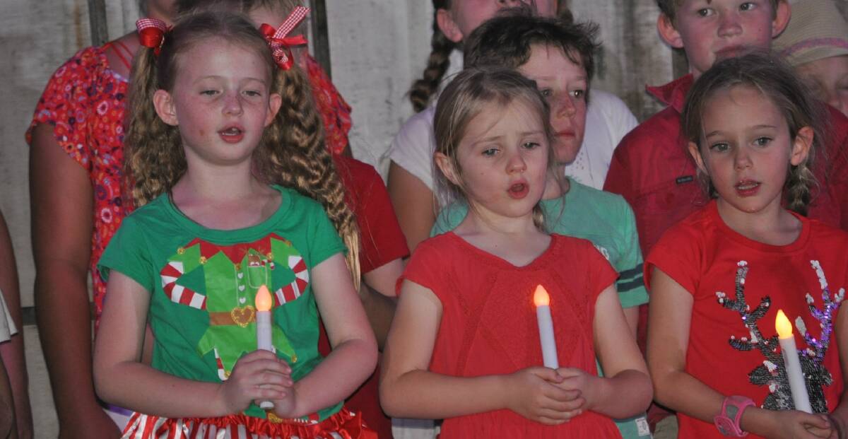 In the spirit: Mullaley Public School sing Go light your world at the carols event. Photo: Marie Hobson
