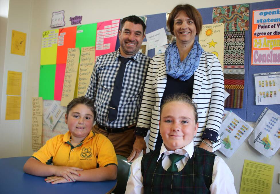 LEARNING EXPERIENCE: Canadian visitor, Julie Chouinard (back, right) with Gunnedah Public School deputy principal, Will Dowe, with students Shakira Conomos and Ebony Herbert.