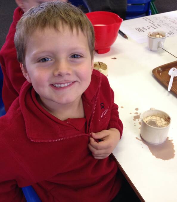 Carinya Christian School student Angus Lindfield enjoys "tasting" his hot chocolate as part of the school's science experiments.