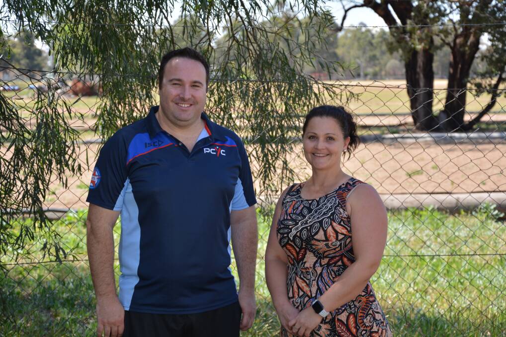 COMMUNITY BENEFITS: Andrew Foreman from Gunnedah PCYC and Jess Blair from Gunnedah Family Support Home Base are pleased to receive a grant for a fencing upgrade at the PCYC from Tamworth MP Kevin Anderson. 