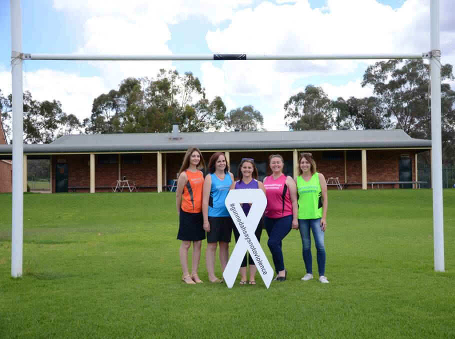 TAKING A STAND: Amber-Lee Donnelly, Rachel Bulkeley, Jess Blair, Kate Mackley and Lenelle Ritter are well prepared for the touch rugby gala day on Saturday. Photo: Billy Jupp