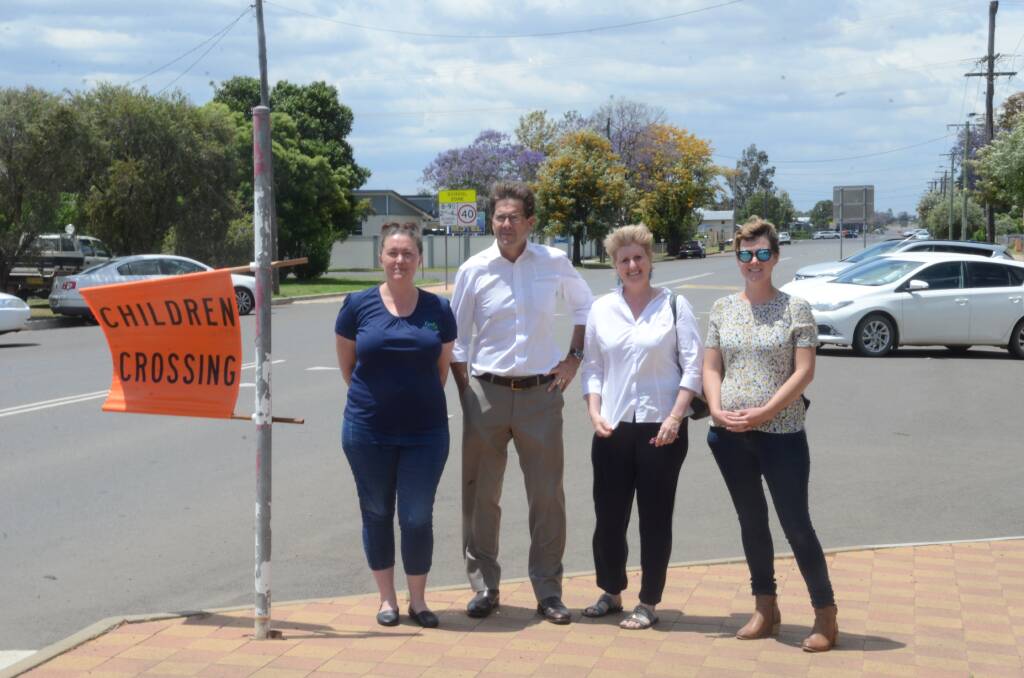 FOR THE CHILDREN: Kate Mackley, Kevin Anderson, Lisa Warren and Jade Punch discuss a crossing supervisor for Gunnedah Public School on Bloomfield Street. Photo: Billy Jupp