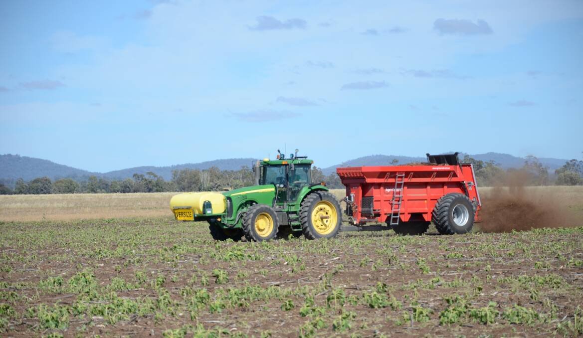 HARD AT WORK: A tractor spreads fertiliser at the Lyle's Nea property. Photo: Billy Jupp