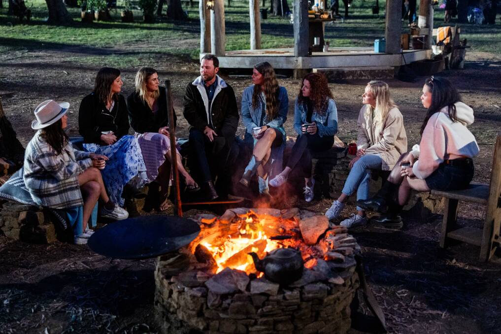 Farmer Todd holds a swag of girls captive with his tale about the time he lost his hat while telling a story to some girls around a campfire. Picture supplied