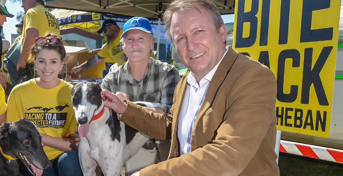 DEFIANCE: Kevin Humphries - here at AgQuip with Greyhound Alliance members - voted against the ban on greyhound racing. Photo: Peter Hardin 180816PHA03