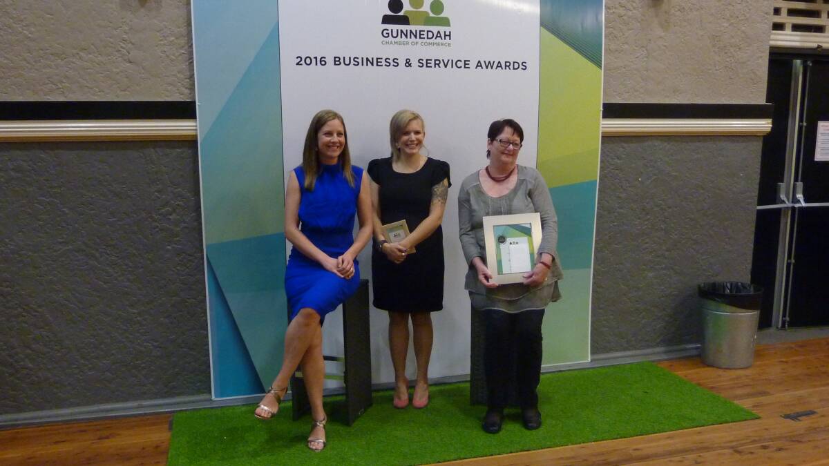 Kaye Morrison (right) is presented with the Quiet Achievers Award by category sponsors.