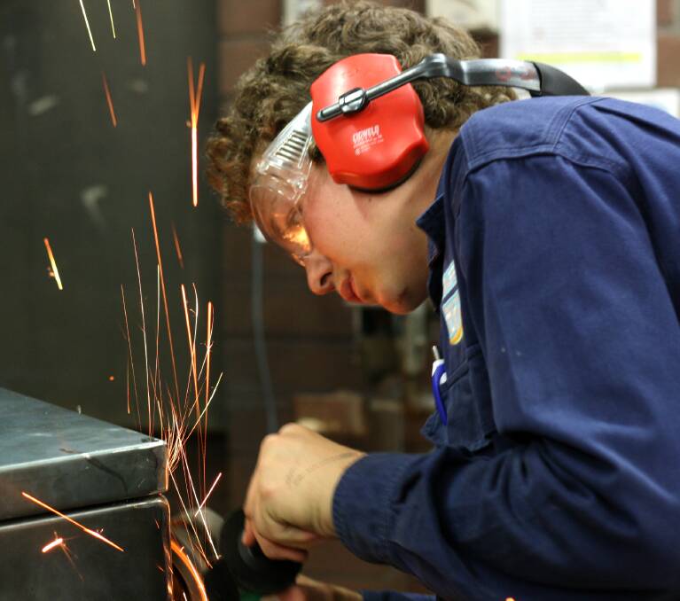 Training up: Cooper Patterson completing a project for his trade training course in Gunnedah last year.