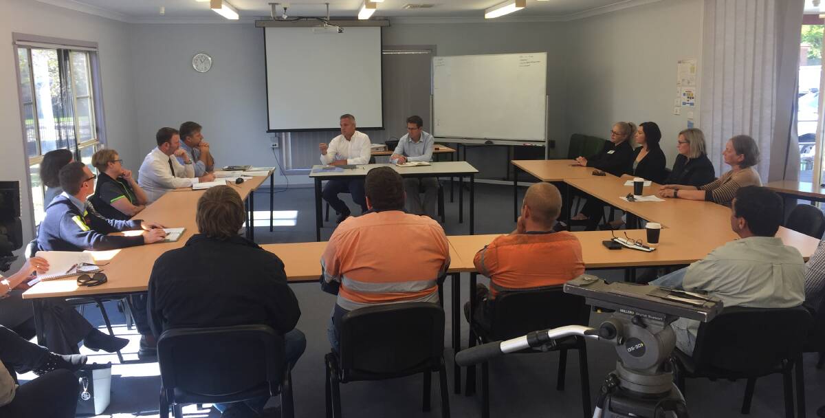 Jon Black and Kevin Anderson with business and industry representatives at Gunnedah TAFE on Monday.