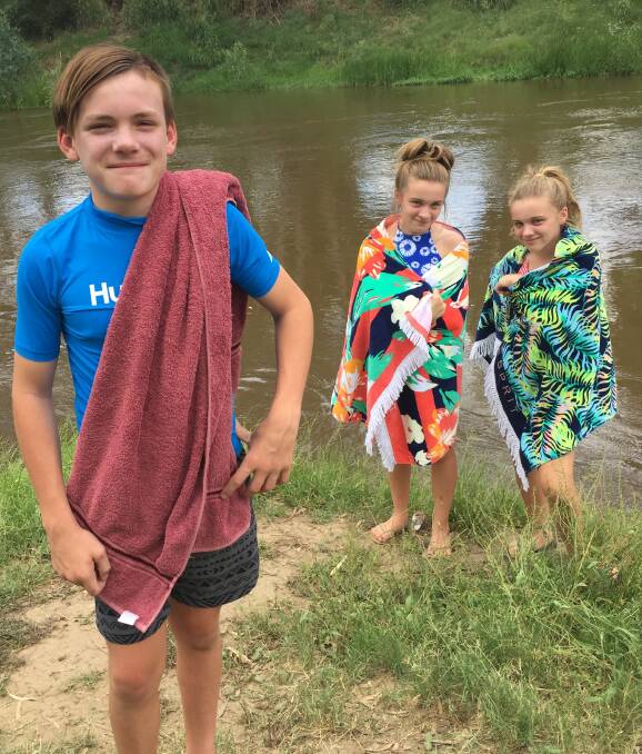 River raiders: Gunnedah's Max Turner, 12, with Chelsea and Lily Turner, both 14, cool off at the Namoi River on Wednesday as the mercury soared into the low 40s.