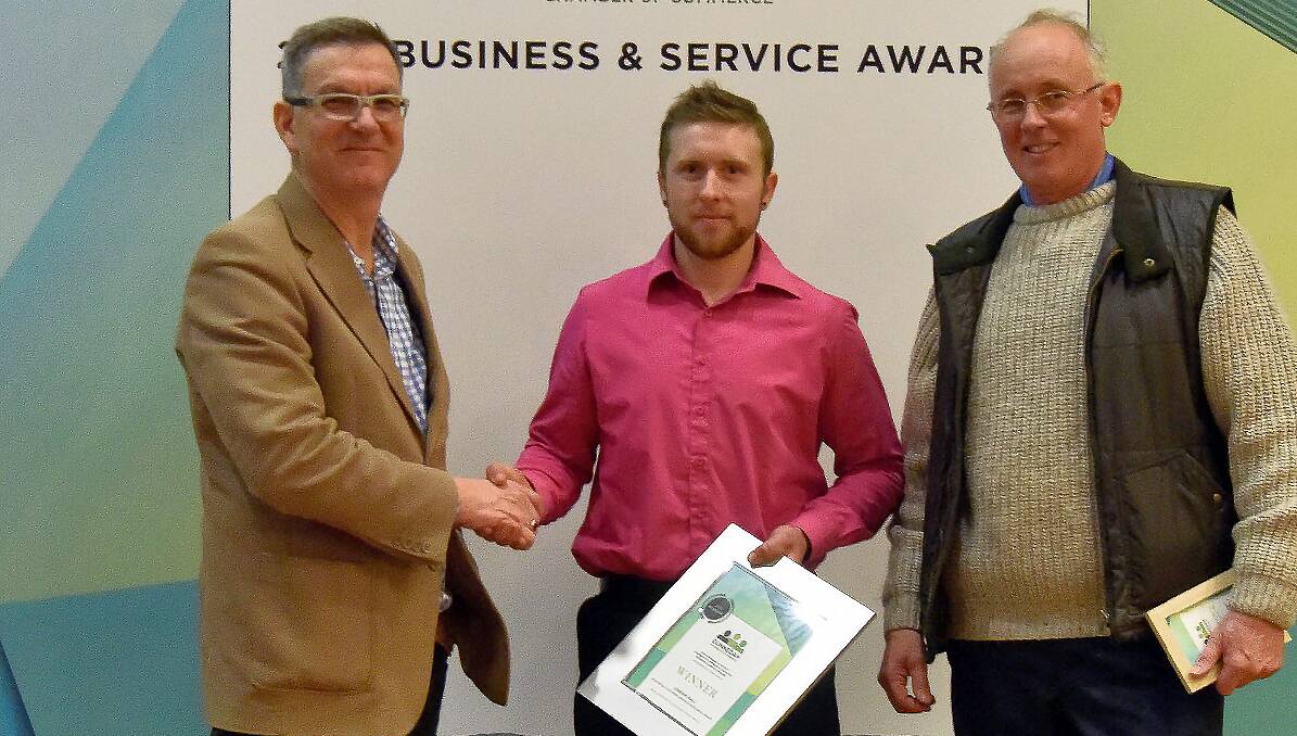 Top marks: Non-retail Customer Service Award winner Jordan Dall (centre) with sponsors Ken Adams and Chris Gittoes during last week's presentation.