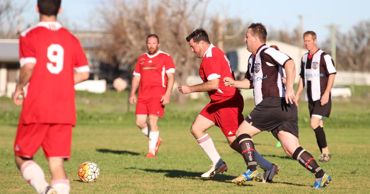 On the Ball: Damien Blinman hunts down possession for the Gunnedah Hawks during Saturday's match against North Companions.