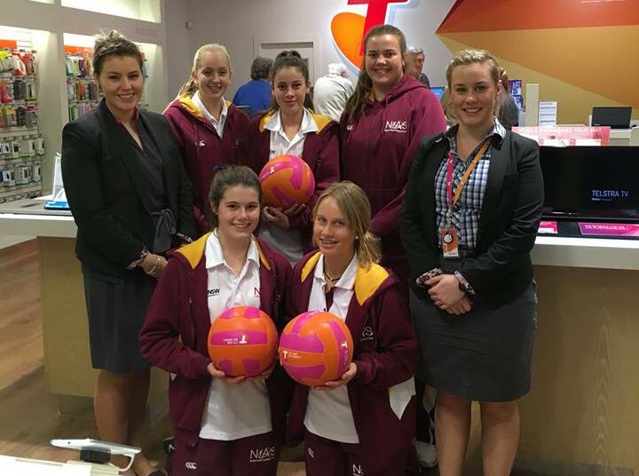 THANKS A BUNCH: NIAS players with new netballs donated by the Telstra store. The NIAS squad will train on Sunday in in preparation for next month's tournament.