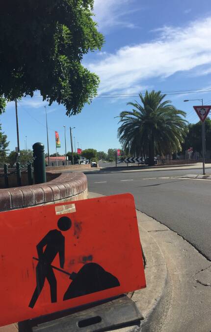 Two-way underway: Road work signs warn Gunnedah motorists entering one-way Chandos Street about the construction site ahead on Tuesday morning.