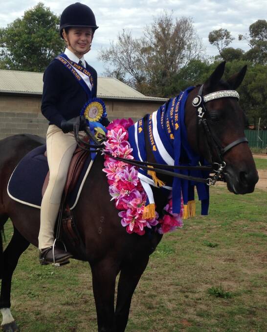 WINNING EFFORT: Gunnedah's Harriet King and her Garland for Supreme Hack at the recent Narrabri Pony Club Gymkhana. Backed by strong efforts of her clubmates, Harriet also took out Supreme Rider of the Show honours.